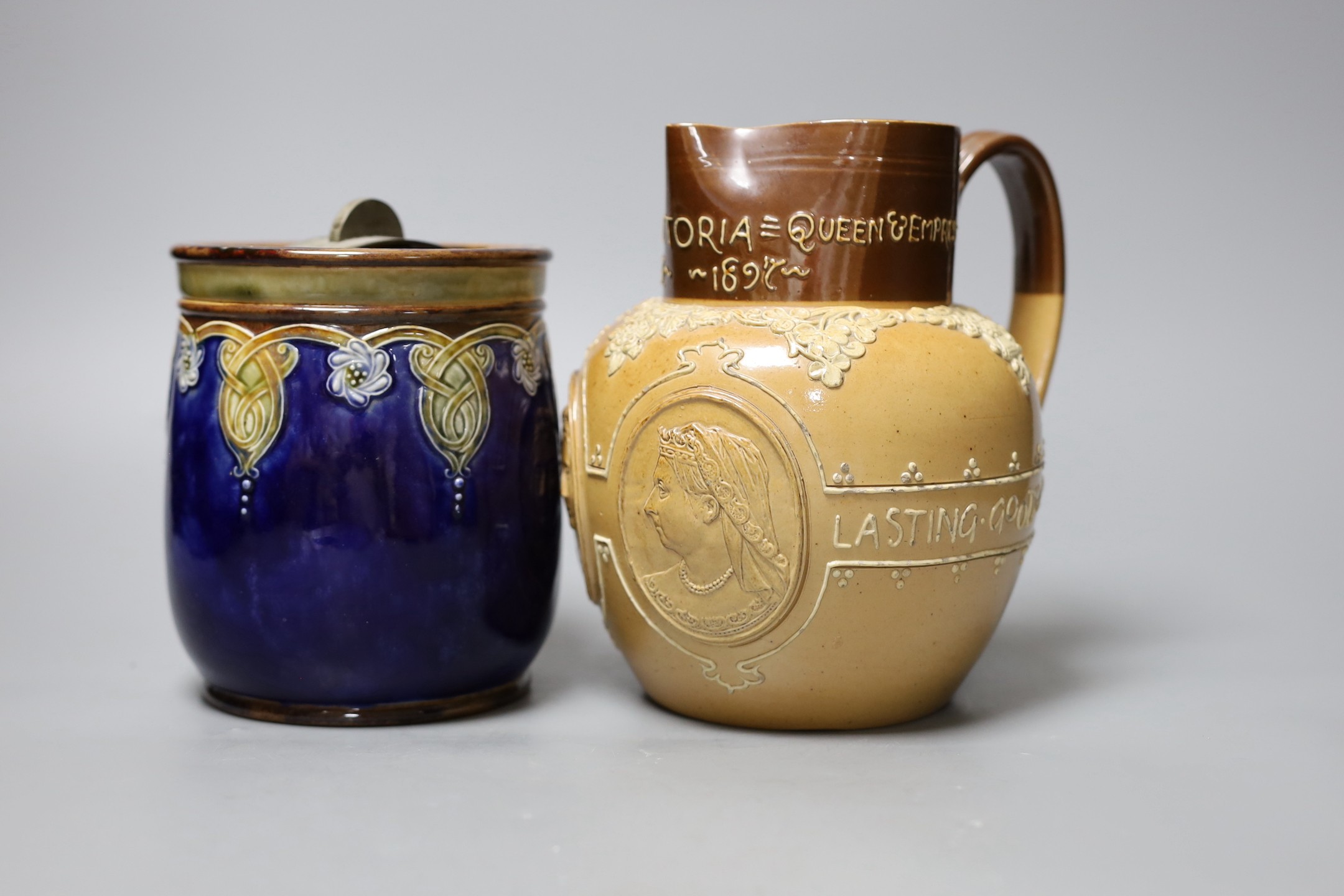 A Doulton Lambeth stoneware tobacco jar and a Queen Victoria Diamond Jubilee commemorative jug, jug 19cms high